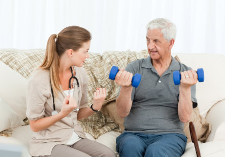 nurse assisting patient to exercise